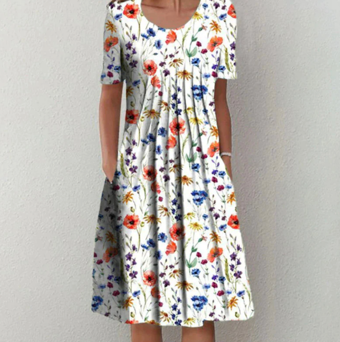 Chic women's printed A-line summer midi dress with elegant pleats, perfect for casual or vacation wear.