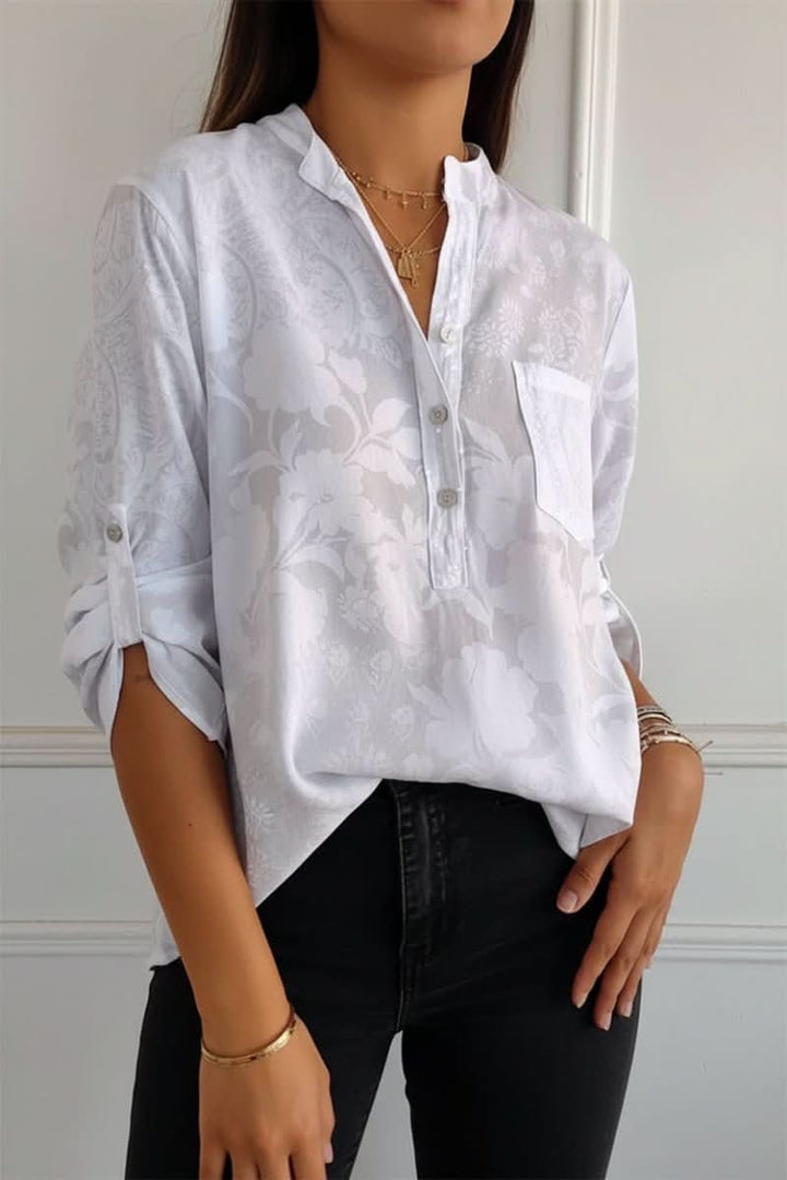 Elegant long sleeve printed top for women, featuring a front pocket, suitable for fashion-forward everyday wear.
