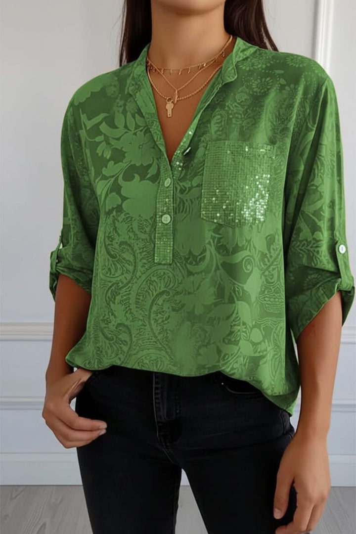 Stylish women's printed shirt, a chic long sleeve top with a functional front pocket for work or casual style.