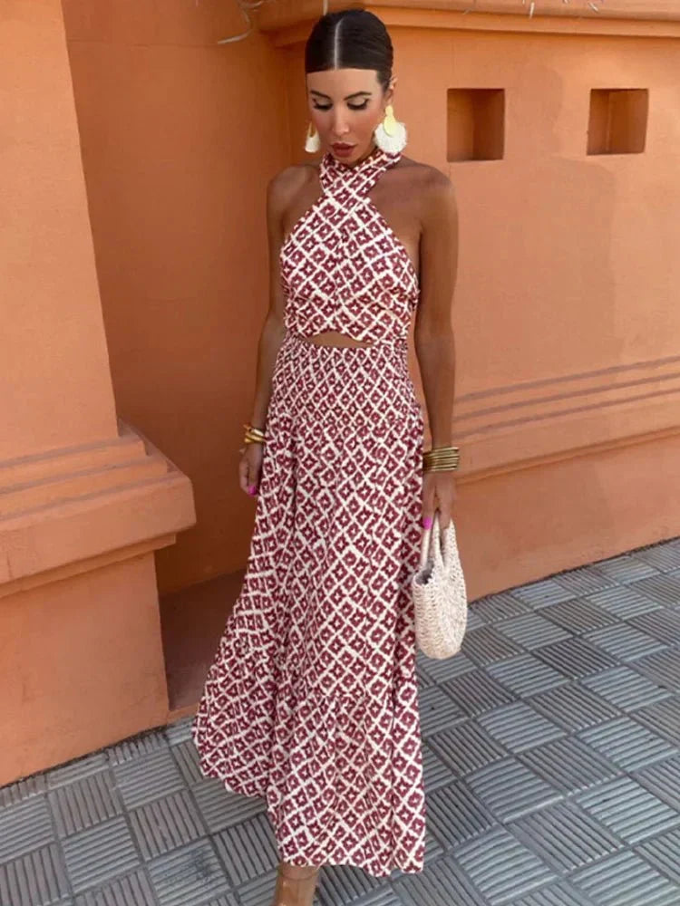 Chic Women's printed halter maxi dress, perfect for wedding guests or elegant occasions, with a flowy silhouette.
