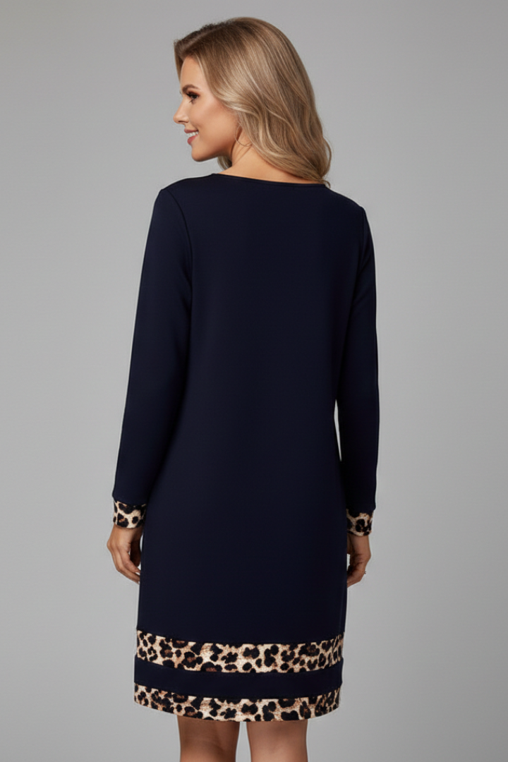 Elegant women's short dress featuring a round neck, long sleeves, and a distinctive patterned hem for a chic, comfortable look.