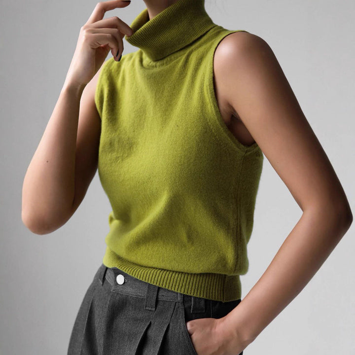 Solid color women's sleeveless mock neck top, offering chic style and a comfortable slim fit.