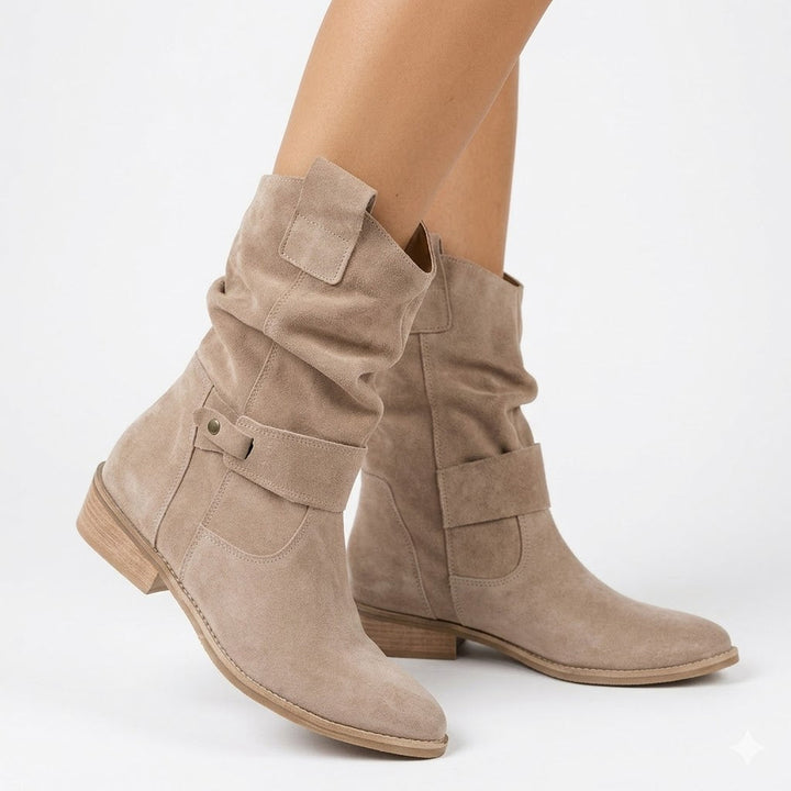 Chic women's slouchy ankle boots with low heel & decorative buckle strap, perfect for versatile fall fashion.
