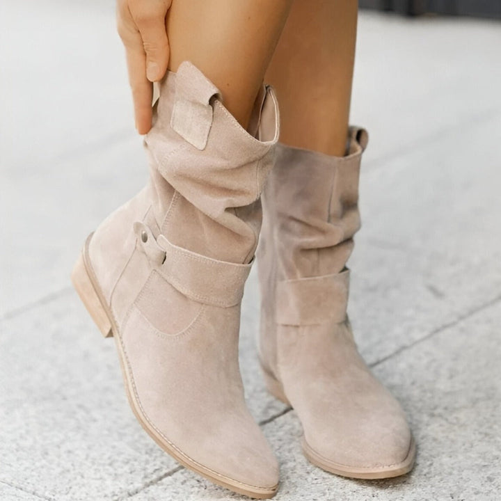 Women's slouchy ankle boots featuring a comfortable low heel and stylish buckle strap, ideal for all-day wear.