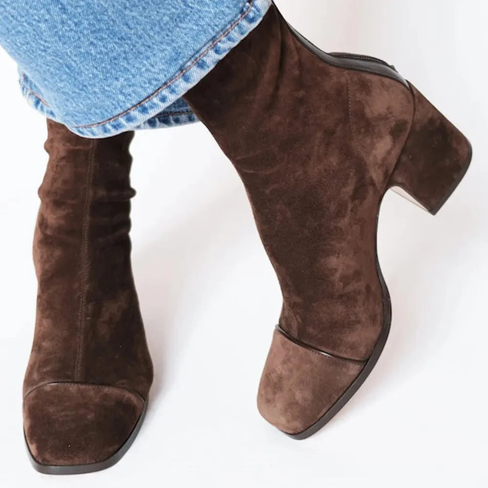 Chic women's square toe heeled boots with a block heel, perfect for stylish fall and winter outfits.