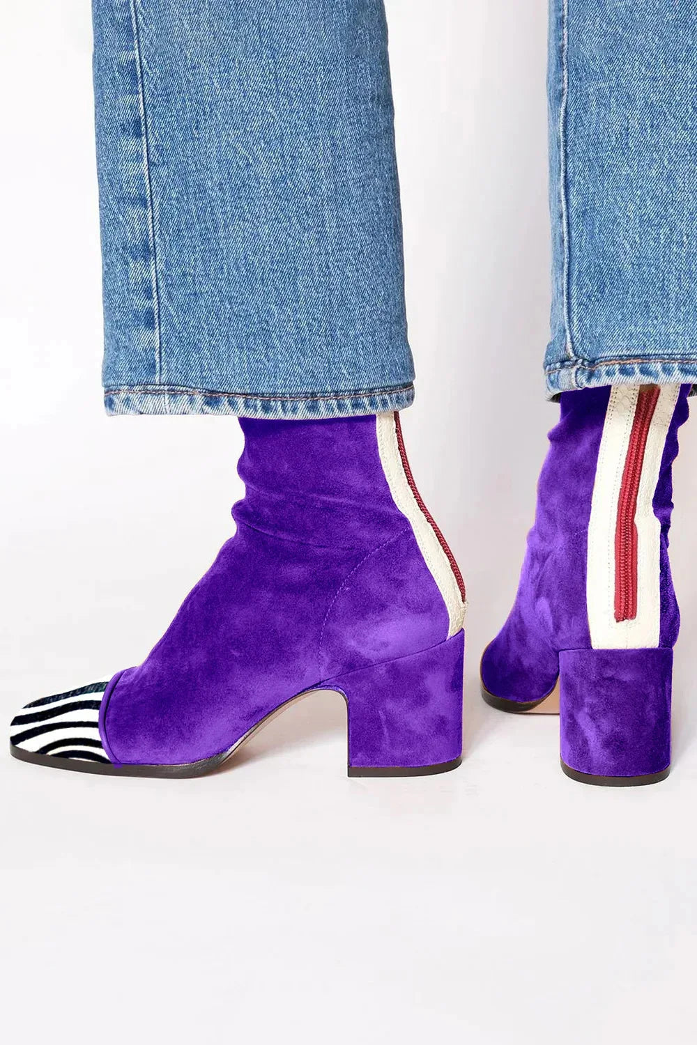 Stylish women's heeled boots with a modern square toe and sturdy block heel, ideal for dressy occasions.