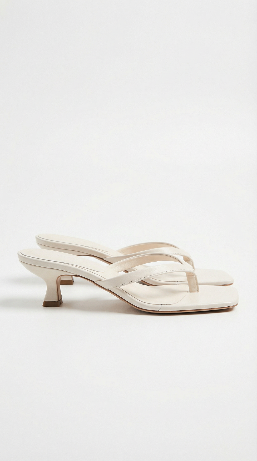 Women's elegant square toe thong sandals with a sophisticated kitten heel.
