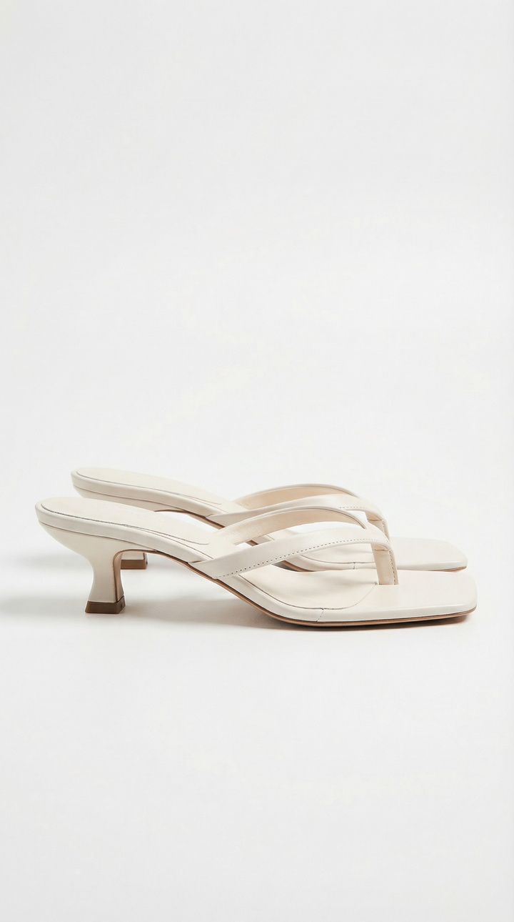 Women's elegant square toe thong sandals with a sophisticated kitten heel.