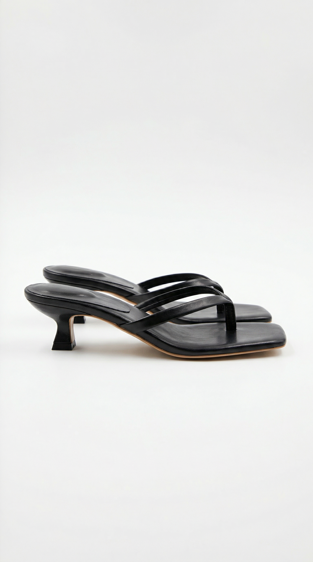 Minimalist women's square toe thong sandals with a comfortable kitten heel.