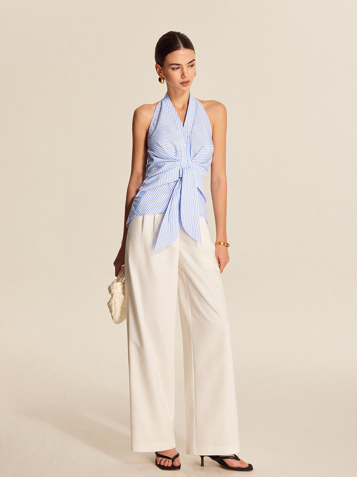 Elegant women's striped halter blouse. Sleeveless tie-front top ideal for workwear or a chic casual look.