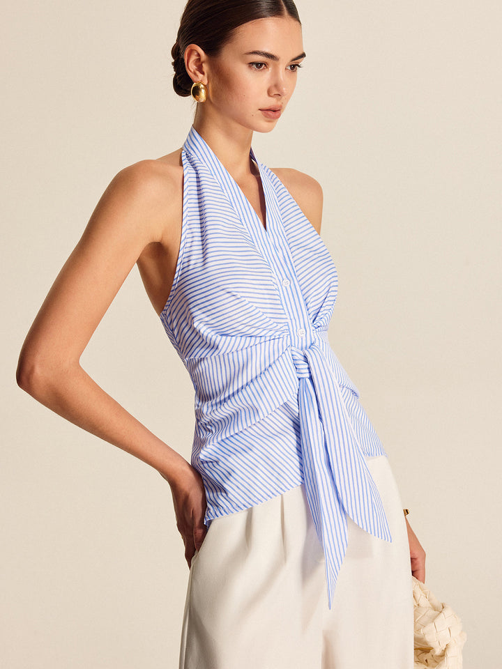 Women's sleeveless striped halter top featuring a stylish tie front. Professional yet versatile for elegant casual outfits.