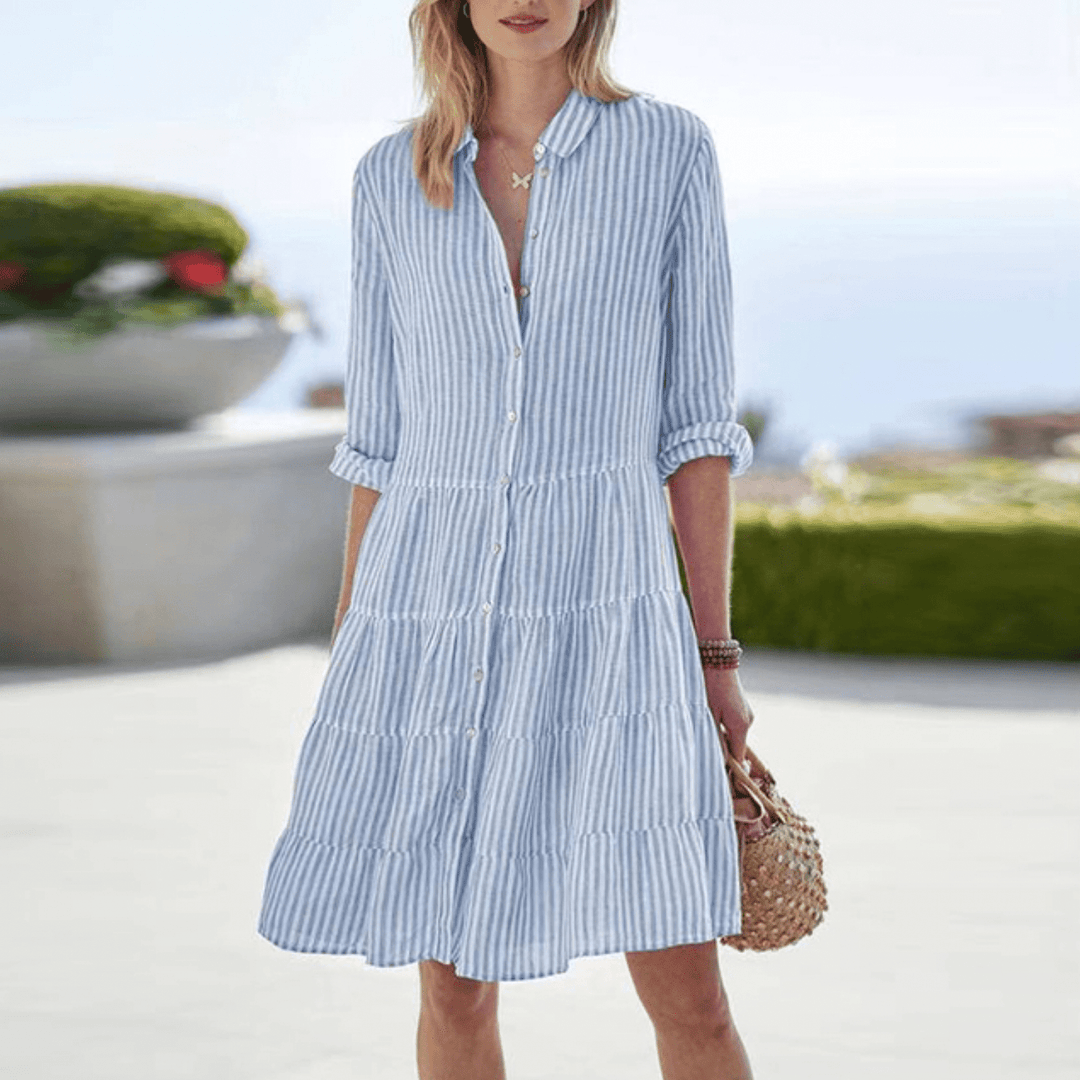 Chic women's striped summer mini dress, perfect for beach days or casual wear. Flowy, comfortable, and elegant.
