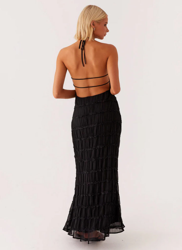 Elegant column halter maxi dress with chic texture, ideal as a stylish women's wedding guest outfit.