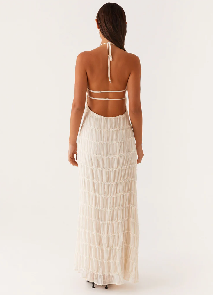 Sophisticated textured halter maxi dress, an elegant women's choice for any wedding guest occasion.