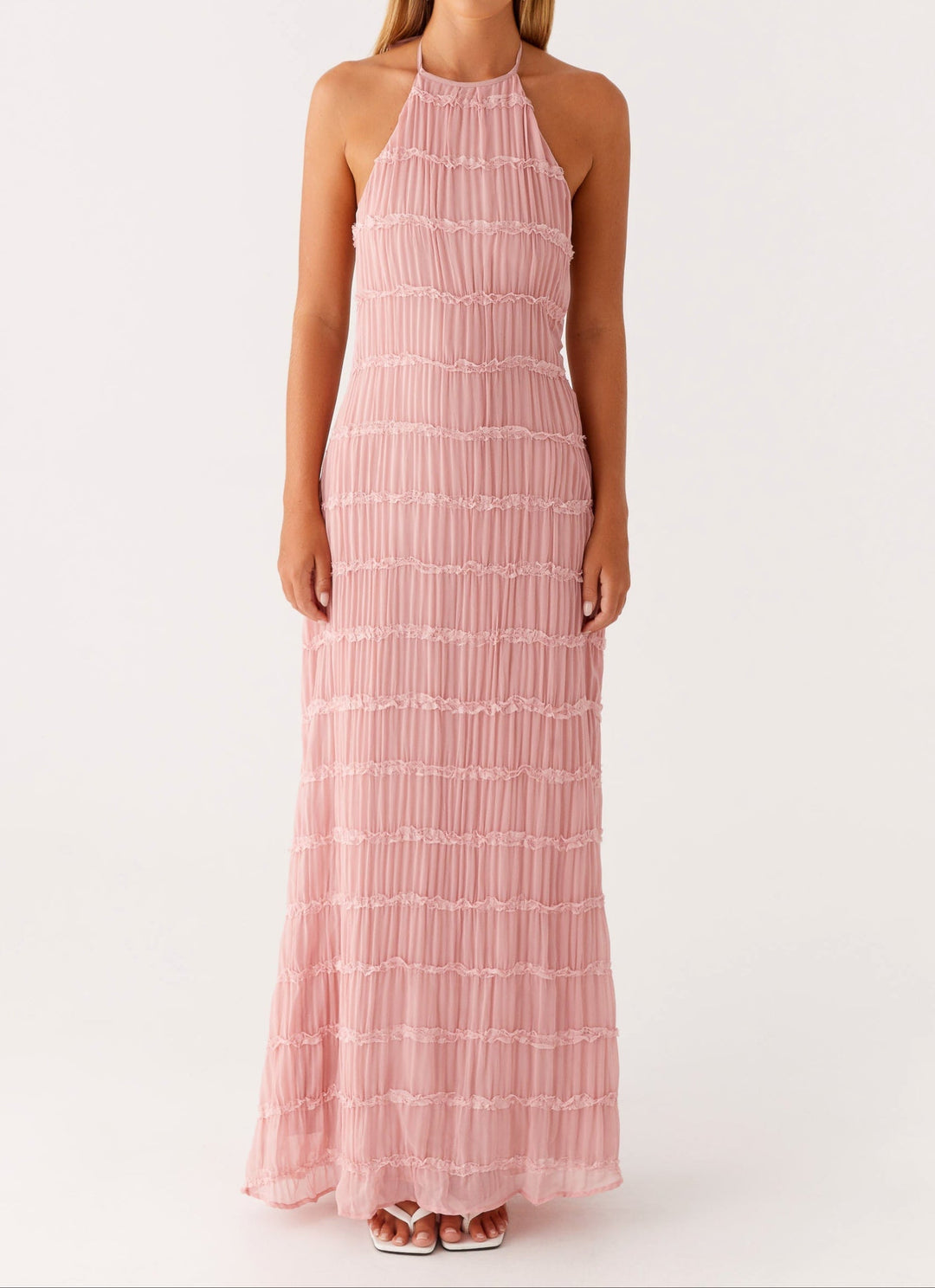 Fashionable long halter wedding guest dress for women, featuring a unique textured fabric design.