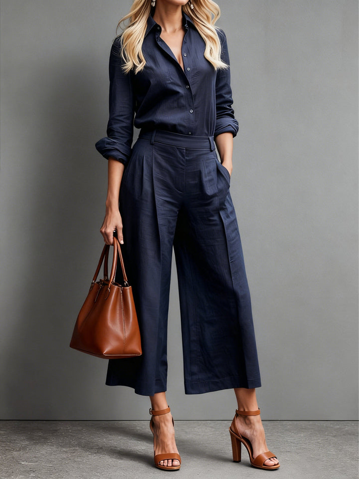 Comfortable women's two-piece wide leg pants & button-down shirt set. Versatile for casual or elegant summer outfits.