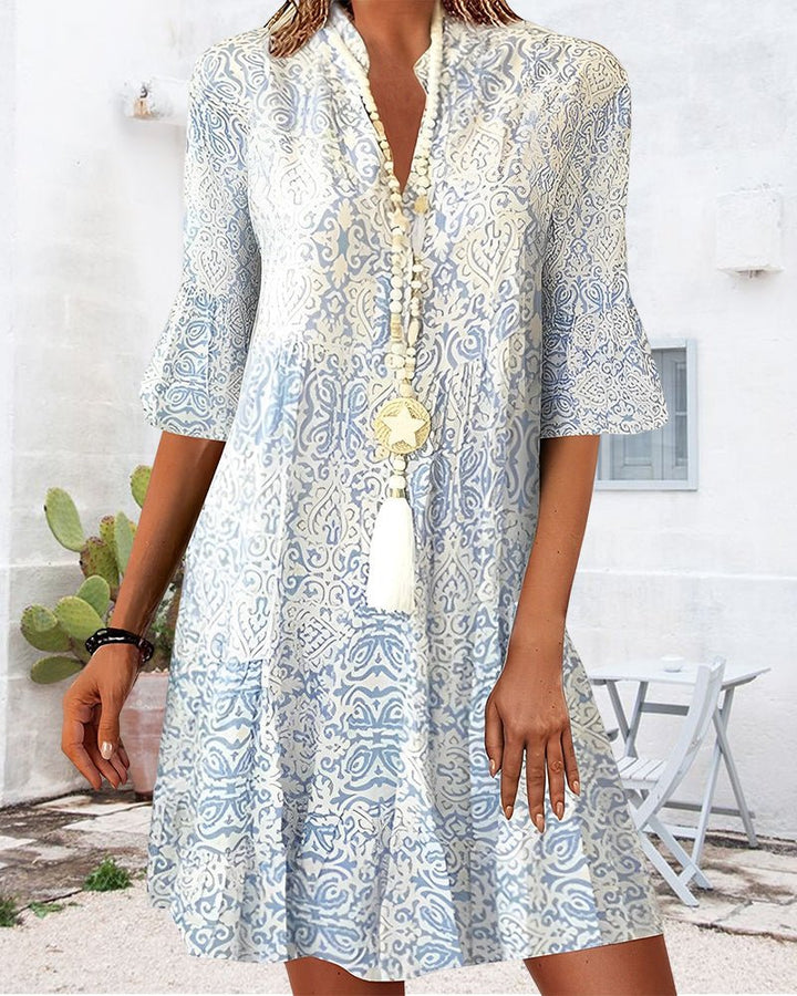 Women's floral print mini dress with elegant bell sleeves. Ideal for summer casual wear & brunch.