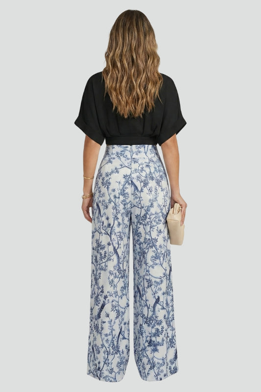 Elegant women's V-neck two-piece set with flowy wide leg pants. Versatile summer outfit for sophisticated casual wear.