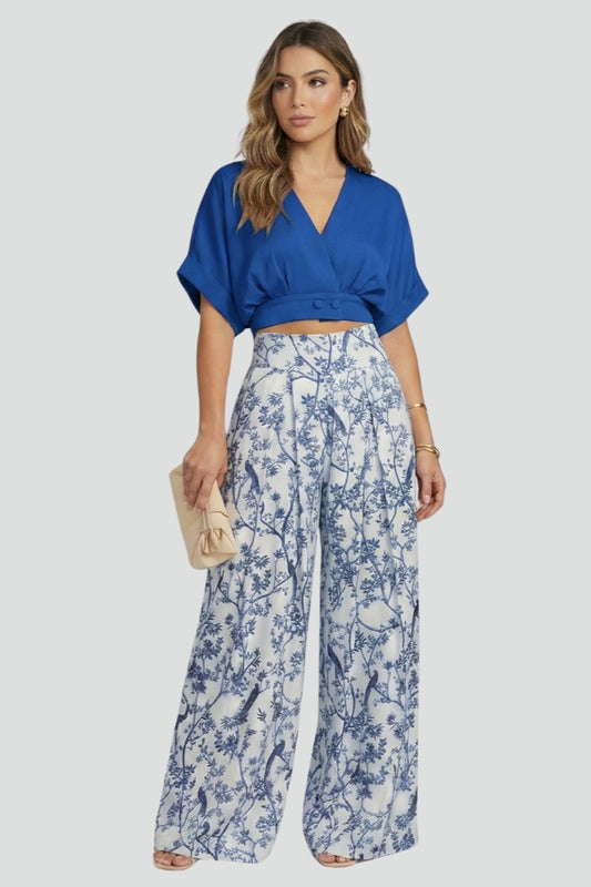 Stylish women's patterned wide leg pants and V-neck top two-piece set. Comfortable and chic for any casual occasion.