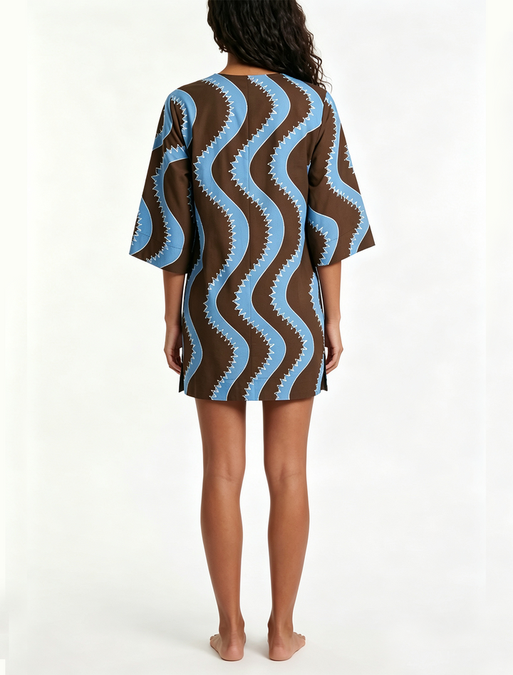 Chic women's patterned mini dress, ideal for brunch or summer fashion, with wave print and elbow sleeves.
