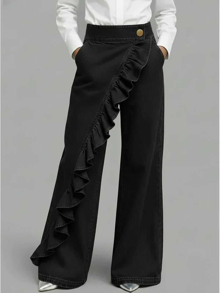 Contemporary women's wide leg jeans with a modern flowing style and distinctive ruffle detail.