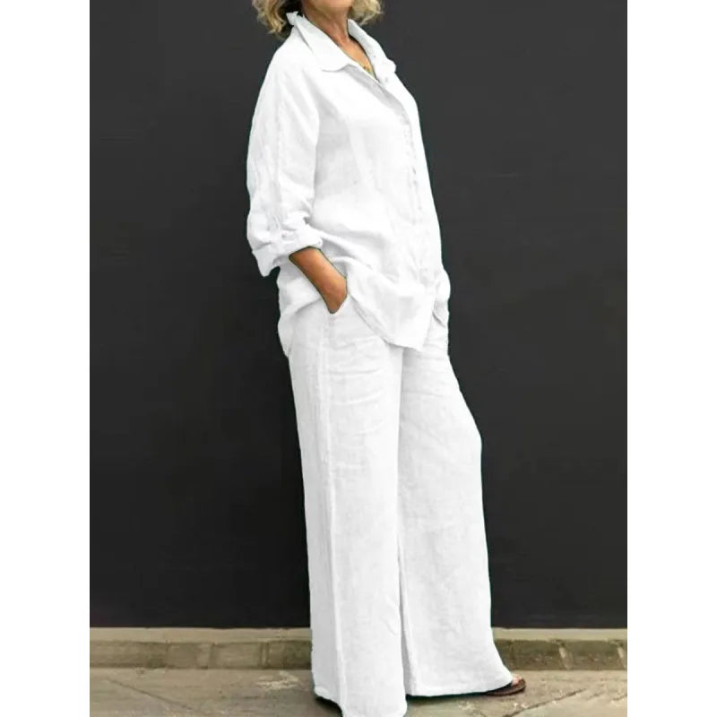 Comfortable black two-piece women's set: long-sleeve button-up shirt and high-waist wide-leg pants.