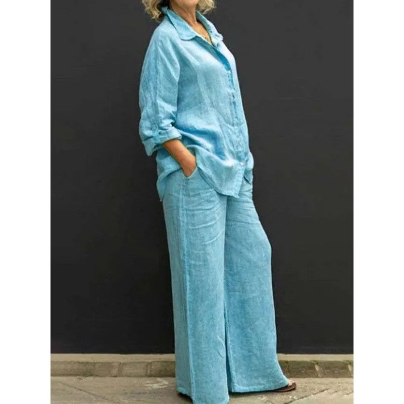 Stylish white women's button-up shirt and flowing wide-leg pants, a perfect casual summer matching set.
