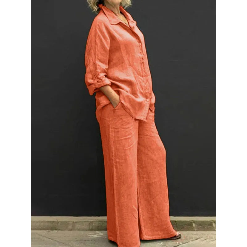 Elegant black two-piece set for women with a button-up shirt and stylish wide-leg pants. Perfect for travel.
