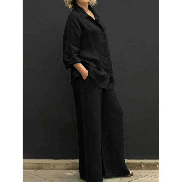 Trendy women's matching set with a classic button-up shirt and flowy wide-leg pants in black. Versatile fashion.