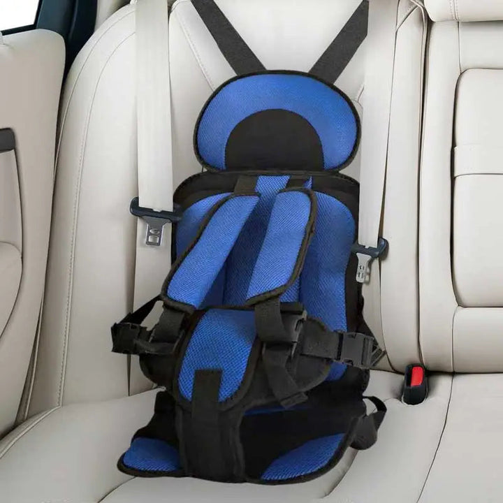 "Child safety car cushion seat in bright red with comfy padding and adjustable straps for secure, cozy travel."