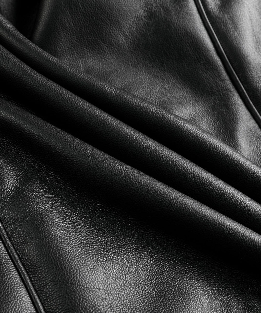Classic unisex aviator coat in black with plush faux shearling, an iconic piece of winter outerwear.