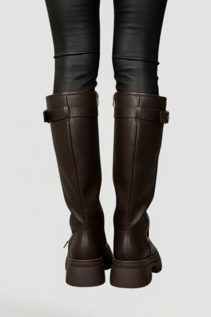 Women's classic black knee-high platform boots. Round toe, side zip, and sturdy platform for stylish winter fashion.