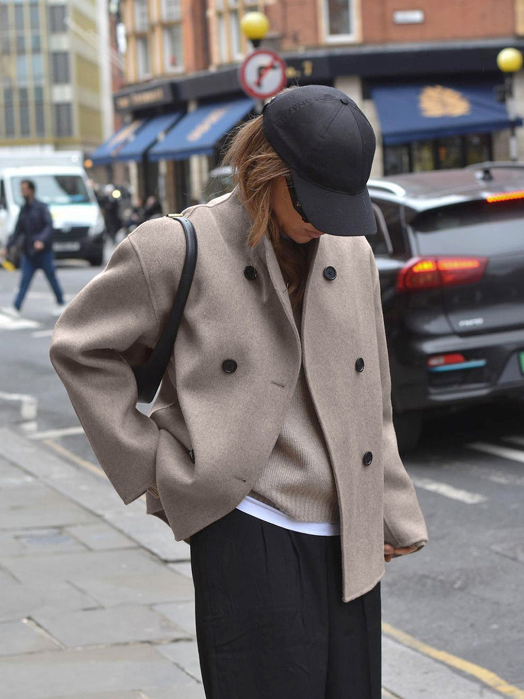 Fashionable women's double-breasted trench coat, a classic style staple for any season