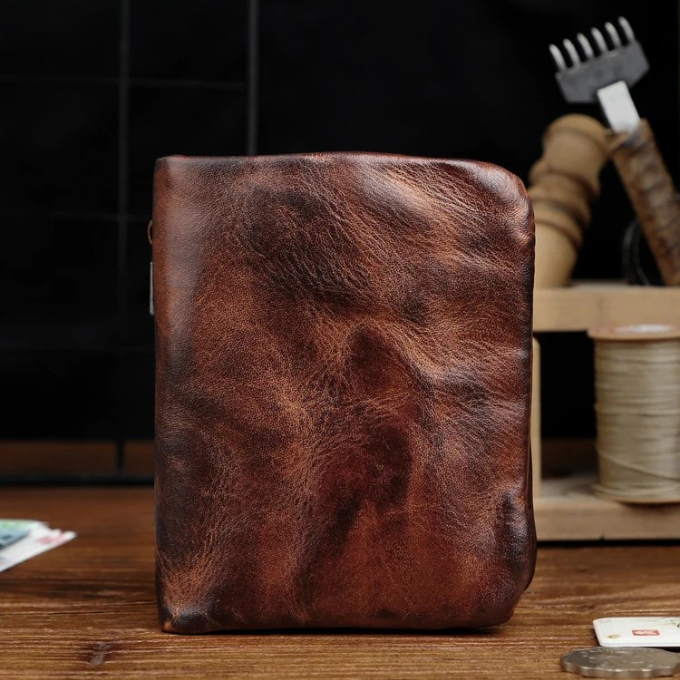 Vintage-style men's rugged full-grain leather wallet, black, closed view, accessory.