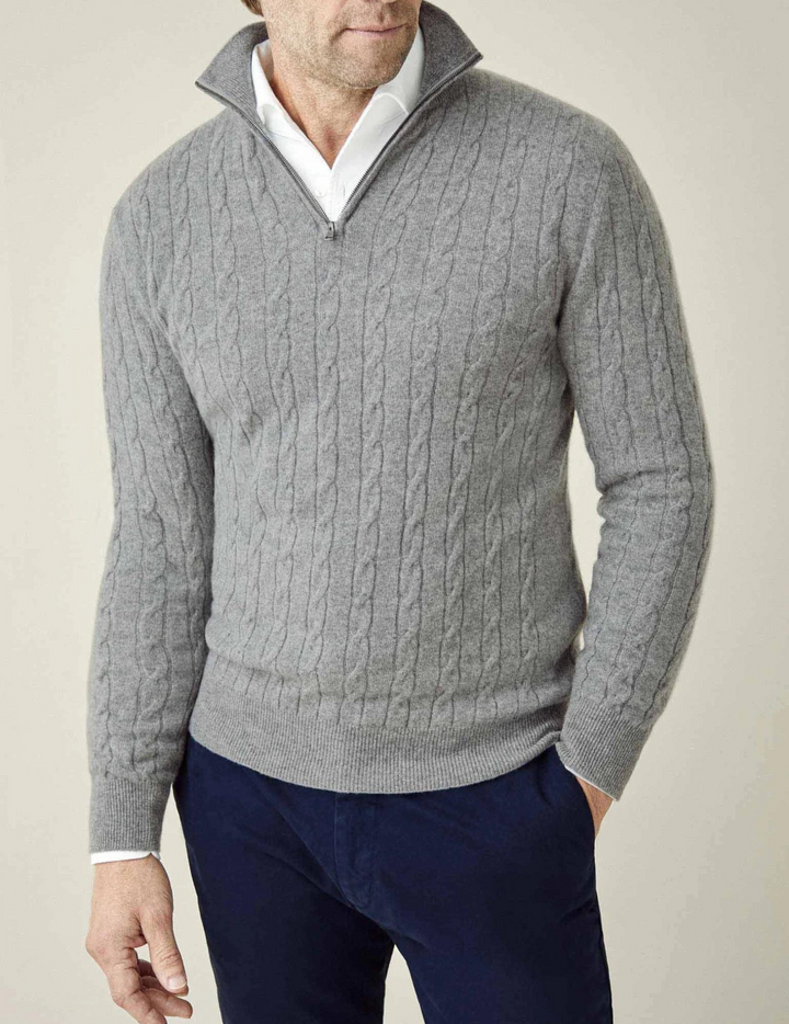 Modern men's cable knit quarter-zip sweater, offering both style and warmth.