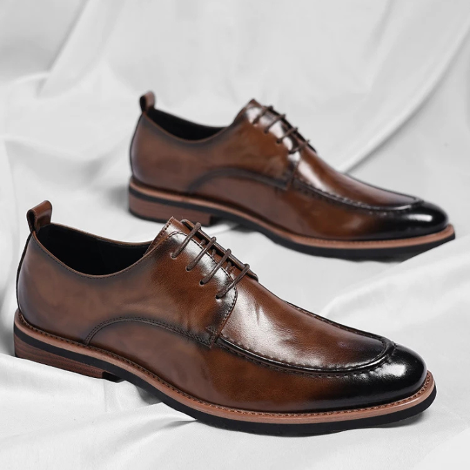 Elegant men's dual-tone Oxford dress shoes with a classic finish, ideal for formal footwear.