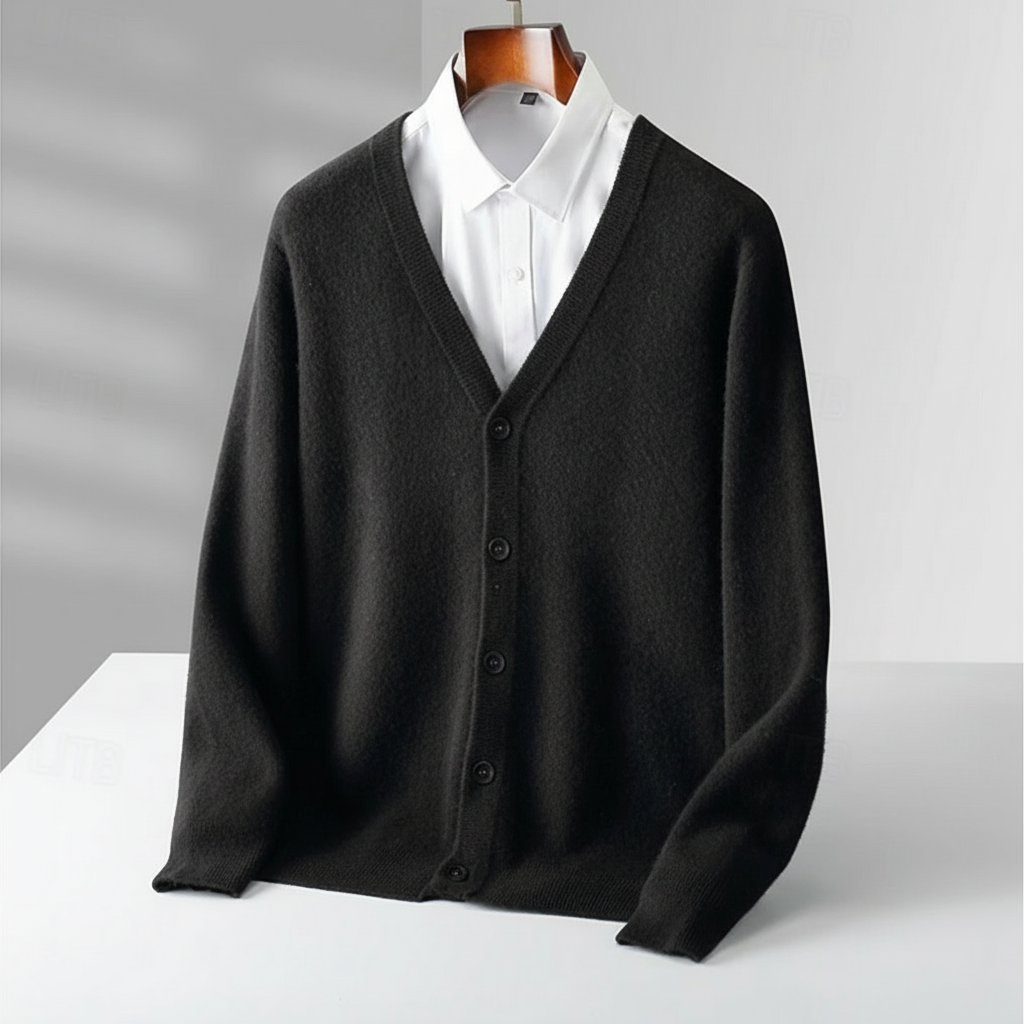 Detail of a men's classic V-neck cardigan, highlighting soft knit fabric and brown buttons. Timeless all-season wear.