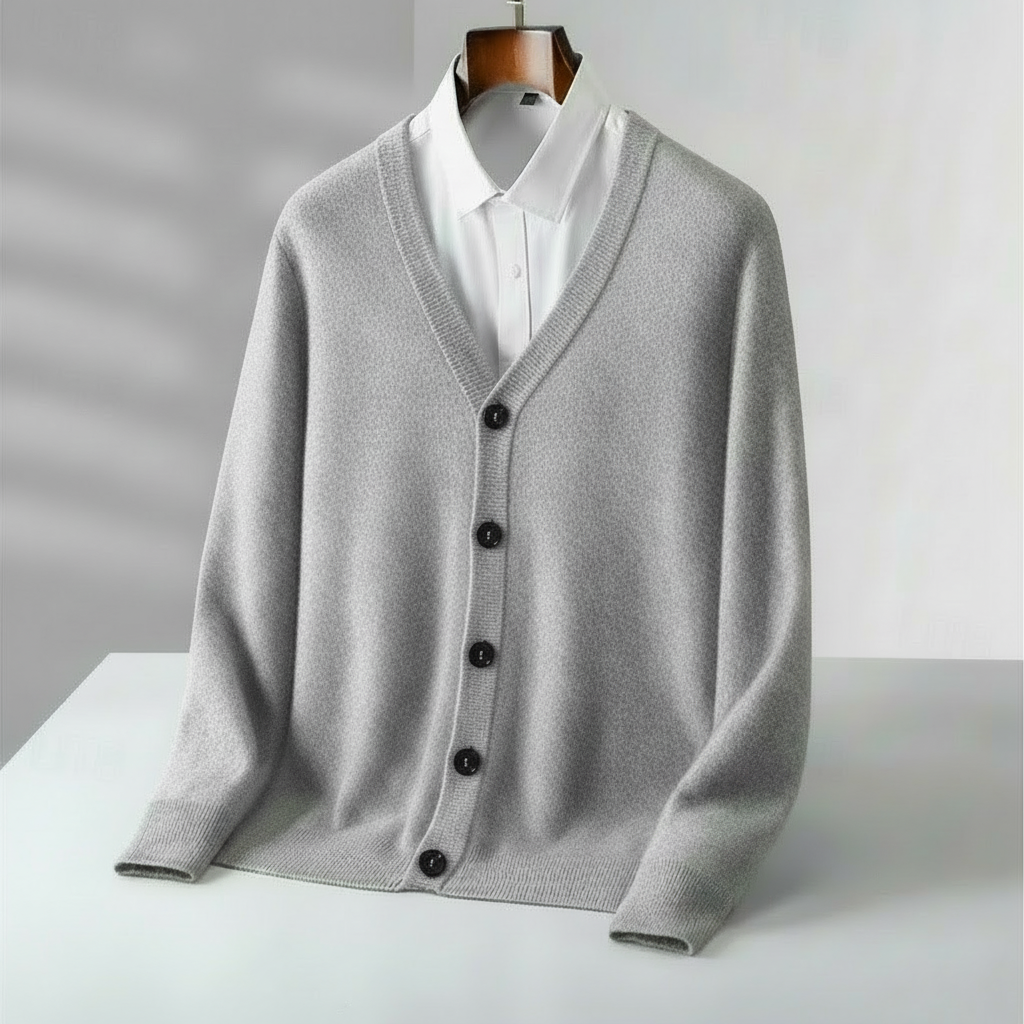 Stylish men's navy V-neck cardigan, a versatile piece for casual or smart casual layering in any season.