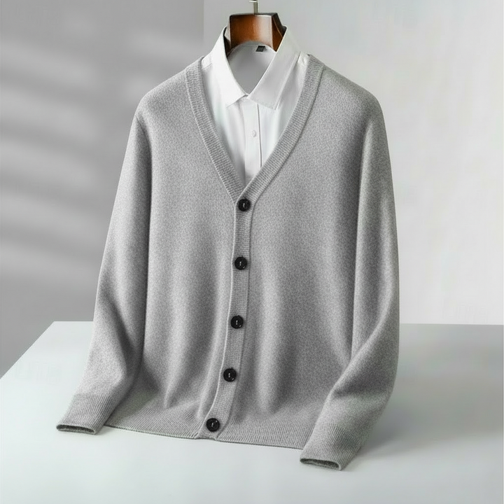 Stylish men's navy V-neck cardigan, a versatile piece for casual or smart casual layering in any season.