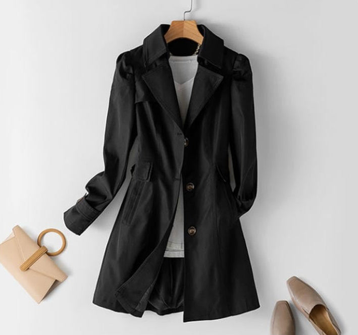 Versatile women's fall trench coat, a classic buttoned jacket with a structured fit for elegant style.
