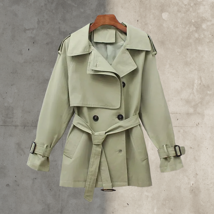 Classic women's double-breasted trench coat with belt, ideal for elegant fall & spring fashion. Sophisticated outerwear.