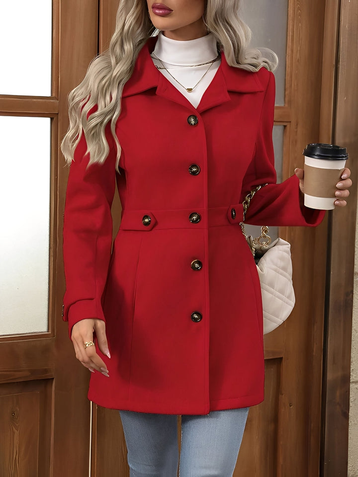 Sophisticated women's double-breasted trench coat, featuring a notch collar and an adjustable belted waist.
