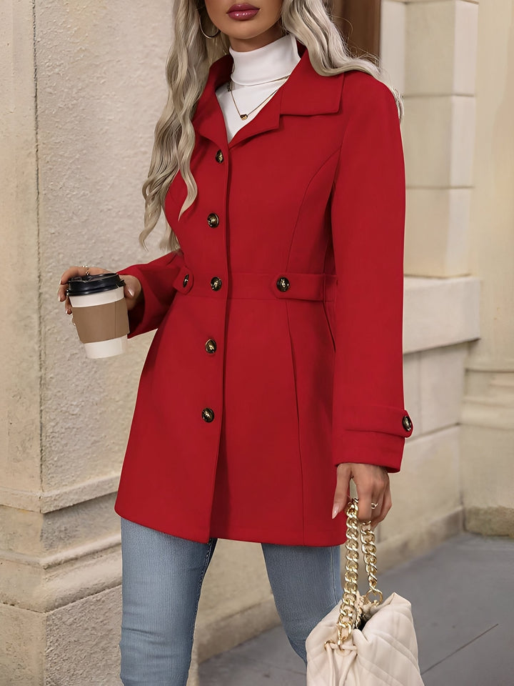 Elegant women's outerwear: classic double-breasted trench coat with a figure-flattering belted waist.