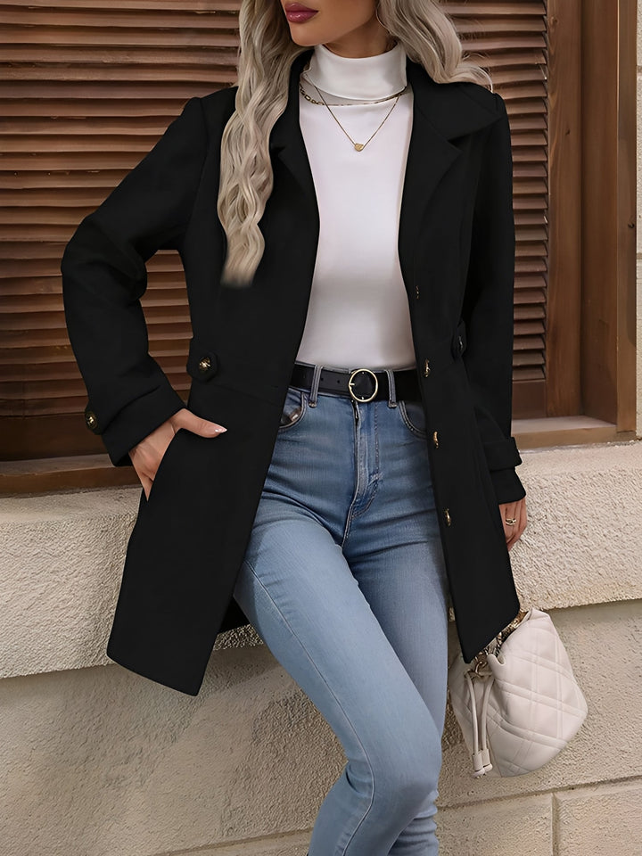 Classic women's transitional jacket, double-breasted trench with belted waist, embodying refined style.