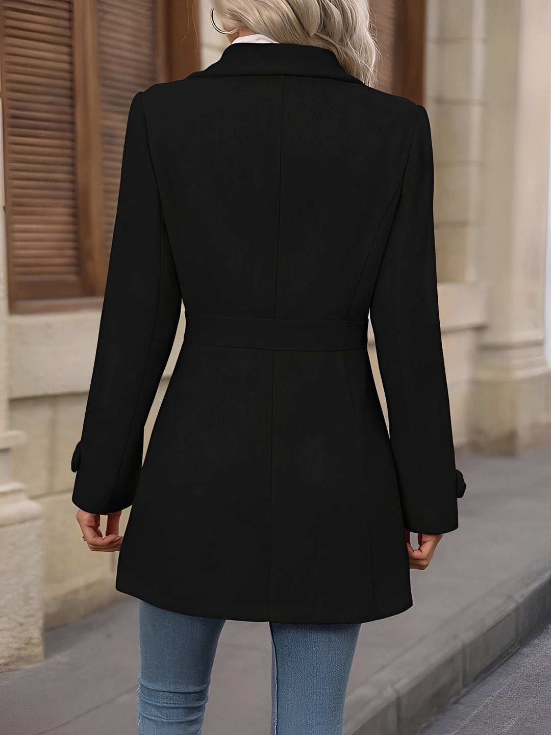 Stylish women's double-breasted trench coat, featuring a notch collar and a sophisticated belted waist.
