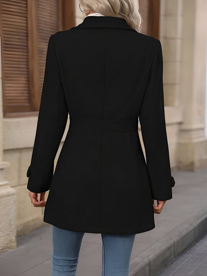 Stylish women's double-breasted trench coat, featuring a notch collar and a sophisticated belted waist.