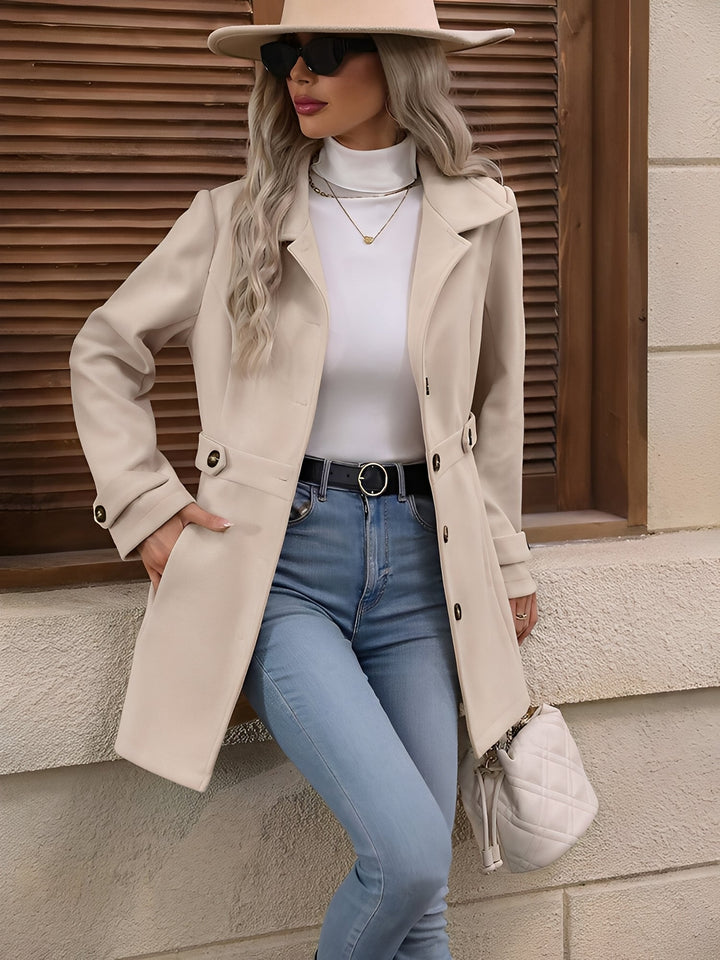 Fall fashion essential: classic women's double-breasted long trench coat with a chic belted waist.