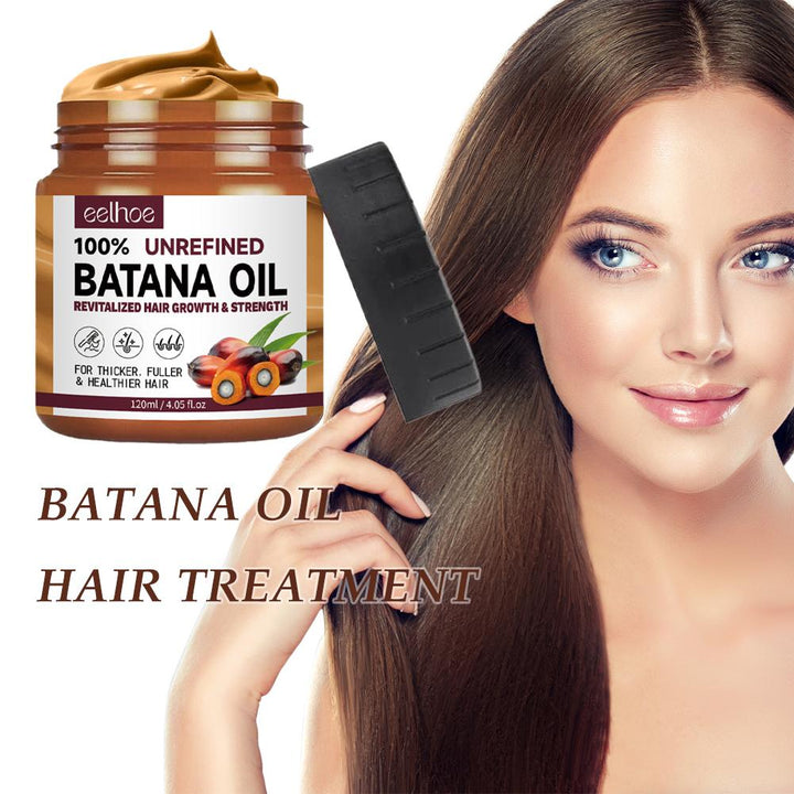 Clear bottle of 100% pure Batana oil for hair and skin care, shown against a plain background, highlighting its rich texture.