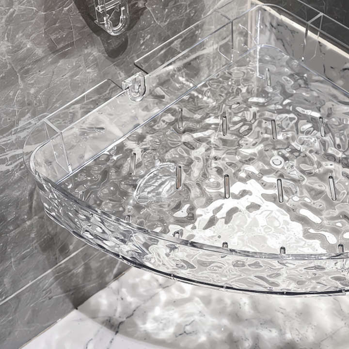 Transparent shower caddy for bathroom wall storage. Holds toiletries, shampoo & conditioner bottles securely.