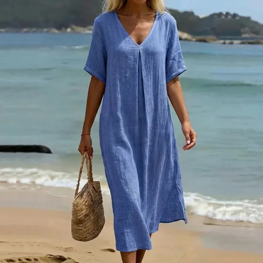 Close-up of a Women's Relaxed V-Neck Midi Dress with short sleeves, showing soft fabric texture.